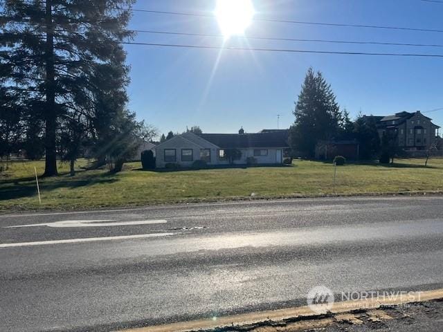 single story home featuring a front yard