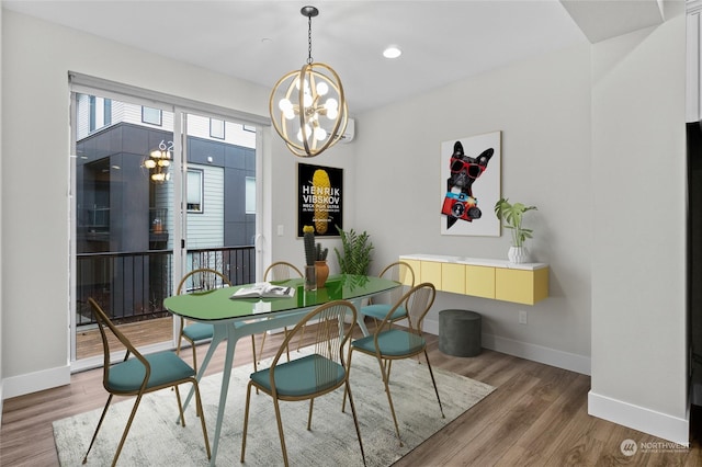 dining space with an inviting chandelier and wood-type flooring