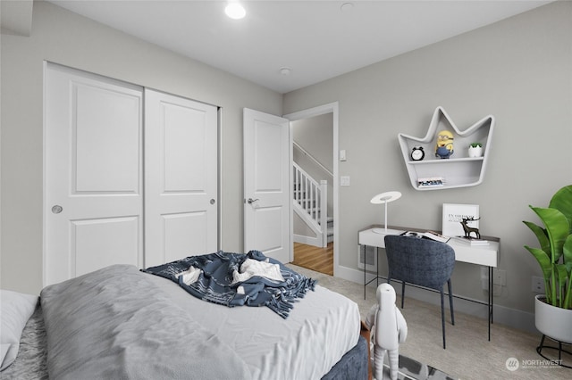 carpeted bedroom featuring a closet