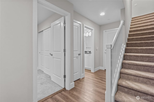 foyer featuring sink and light hardwood / wood-style floors