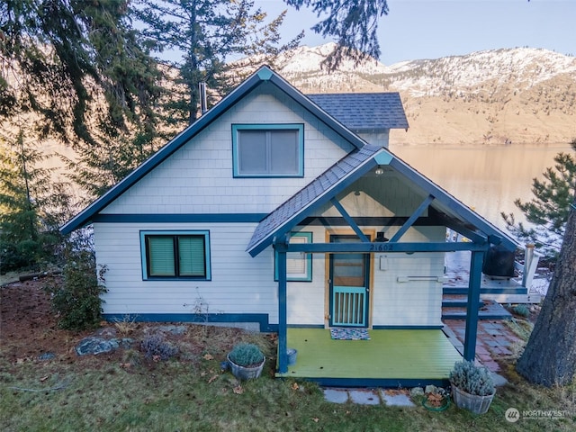 back of property featuring a mountain view