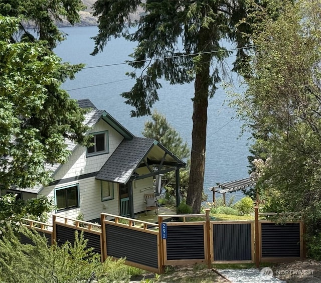 292 Robison Ln, Chelan, WA 98816 - view of side of property featuring a pergola, roof with shingles, and a water view