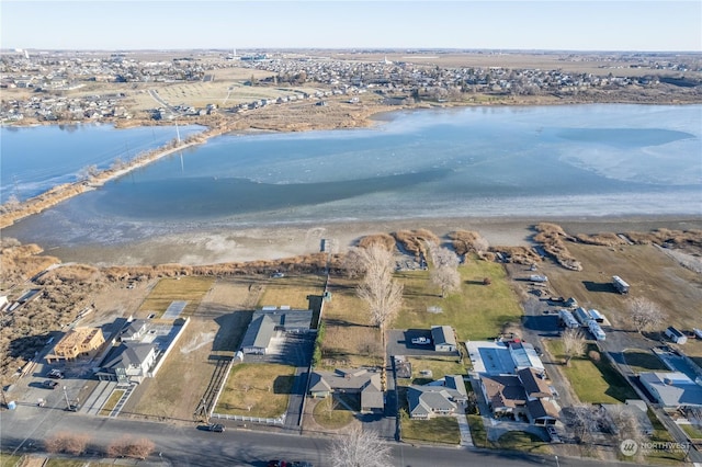 birds eye view of property with a water view