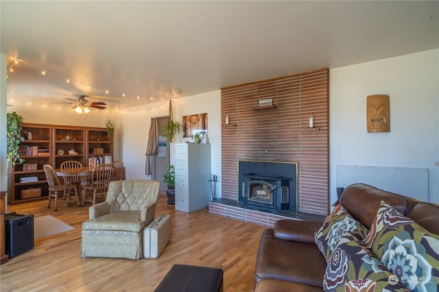 living area featuring a ceiling fan and wood finished floors