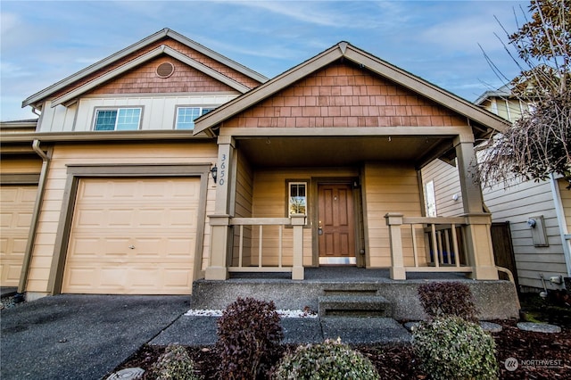 view of front of home with a garage and covered porch