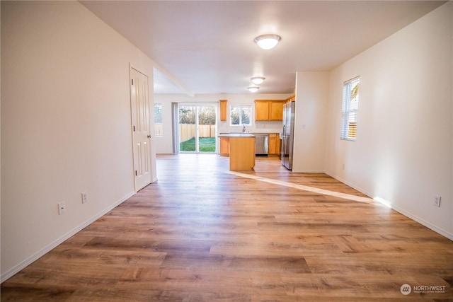 unfurnished living room with light wood-type flooring