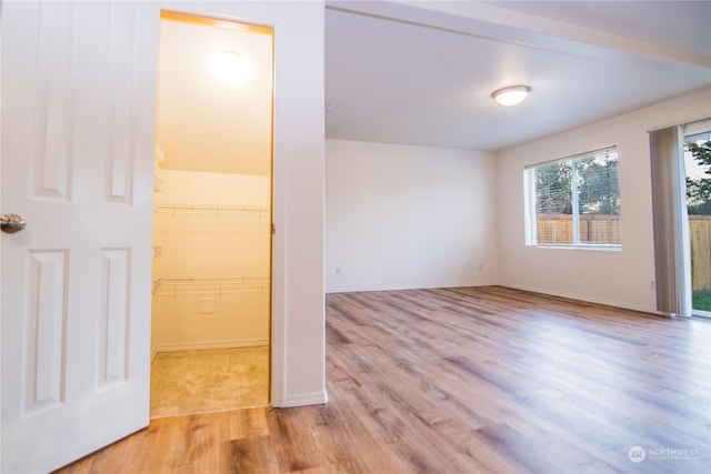 spare room with light hardwood / wood-style floors