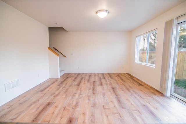 unfurnished living room featuring light hardwood / wood-style floors