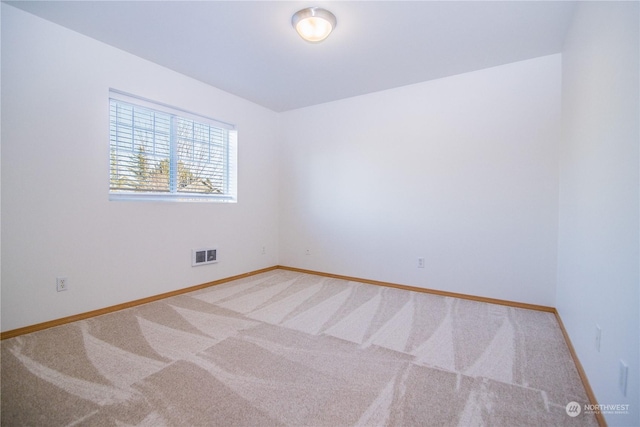 unfurnished room featuring carpet flooring