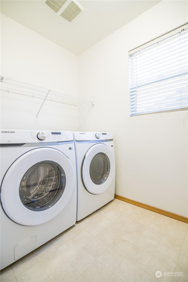 laundry area featuring separate washer and dryer