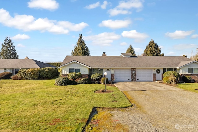 ranch-style house featuring a garage and a front yard