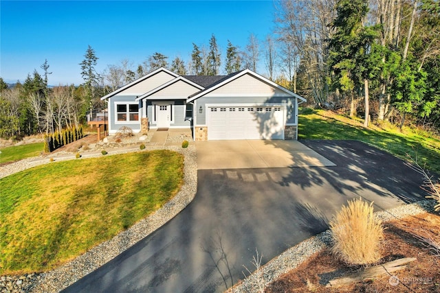 ranch-style house with a garage and a front yard