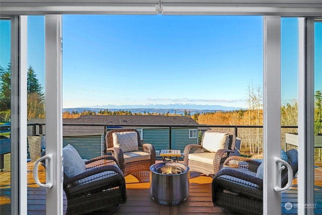 wooden deck with a mountain view