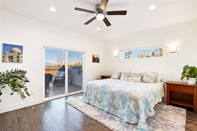 bedroom with multiple windows, dark wood-type flooring, access to outside, and ceiling fan