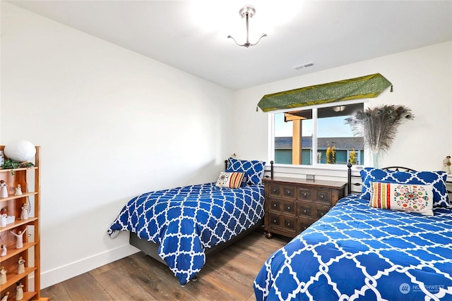 bedroom featuring wood-type flooring