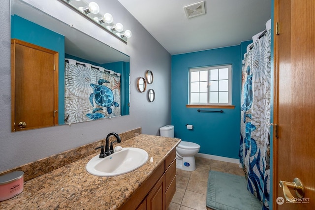 bathroom featuring tile patterned flooring, vanity, a shower with shower curtain, and toilet