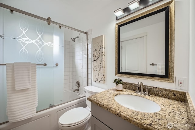 bathroom with toilet, bath / shower combo with glass door, and vanity