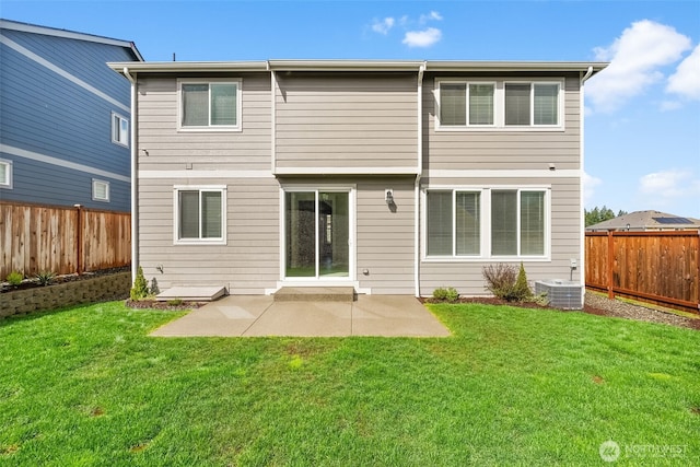 back of property with a lawn, central air condition unit, a patio, and a fenced backyard