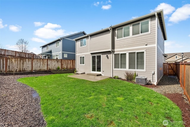 back of property featuring a fenced backyard, a patio area, central AC, and a lawn