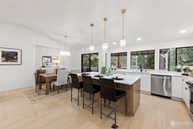 kitchen with white cabinetry, dishwasher, hanging light fixtures, light parquet floors, and a center island