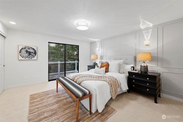 carpeted bedroom featuring access to outside