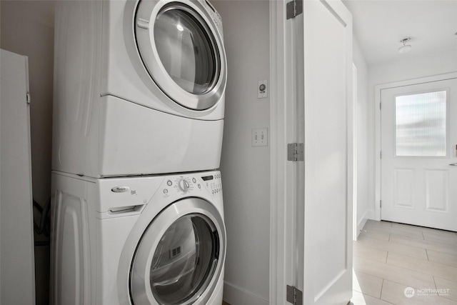 laundry room with stacked washer and clothes dryer