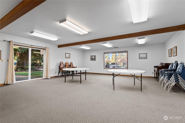 playroom featuring carpet flooring and beam ceiling