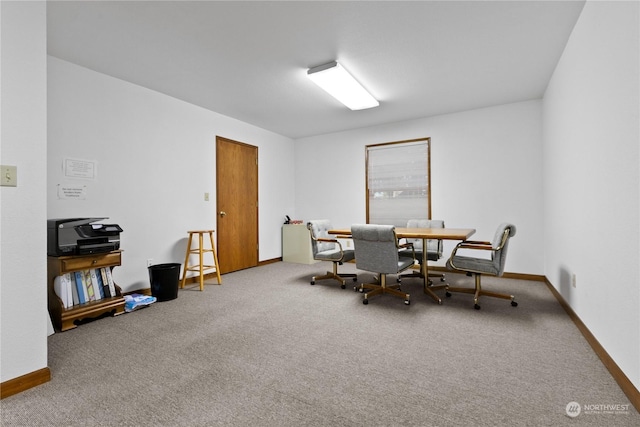 view of carpeted dining area