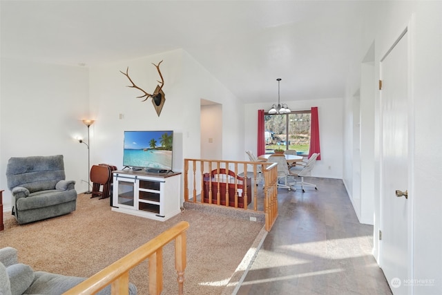 living area with vaulted ceiling and a chandelier