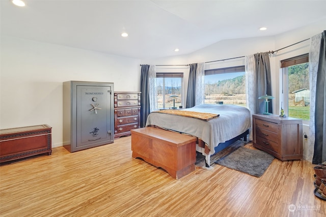 bedroom featuring recessed lighting, lofted ceiling, and light wood-style flooring