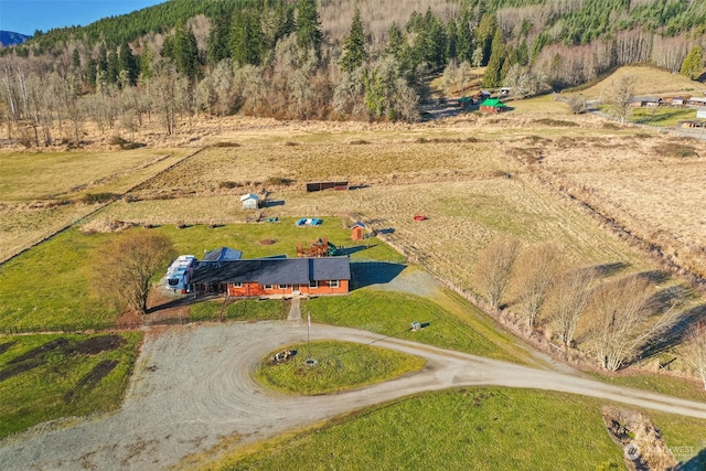 birds eye view of property featuring a rural view