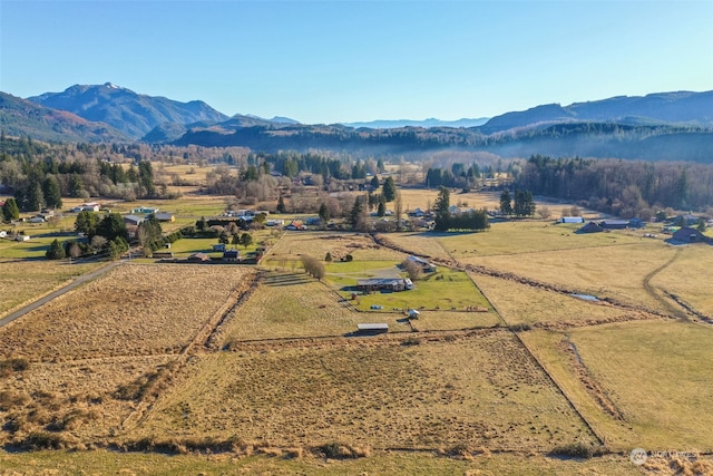 drone / aerial view featuring a rural view and a mountain view