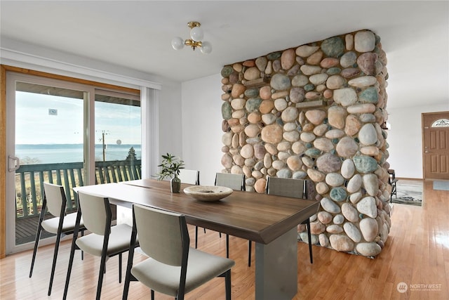 550 SW Waterloo Ave, Oak Harbor, WA 98277 - dining space with a water view and light hardwood / wood-style flooring