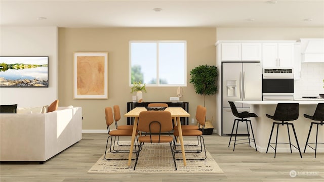 dining space featuring light hardwood / wood-style floors