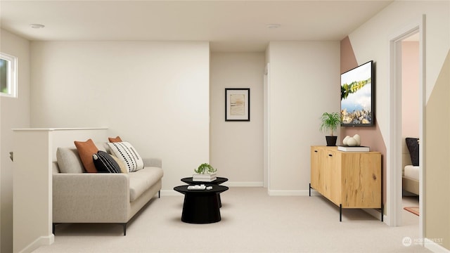 sitting room featuring light carpet