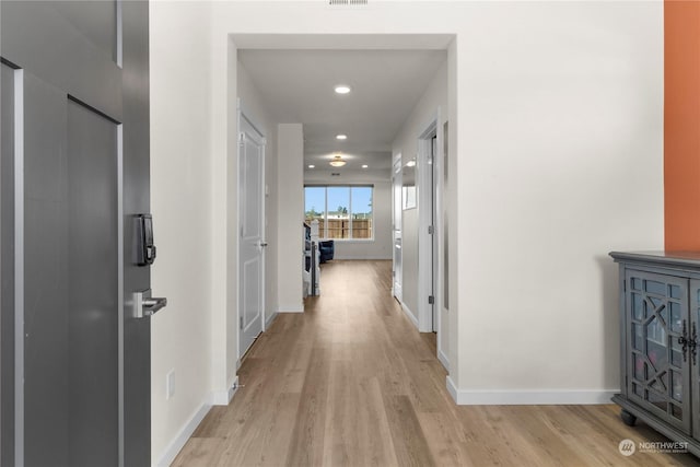 hall featuring light wood-type flooring