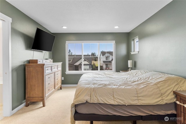 bedroom with light colored carpet