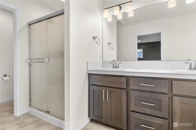 bathroom with vanity and walk in shower