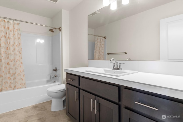 full bathroom featuring shower / bath combo with shower curtain, vanity, and toilet