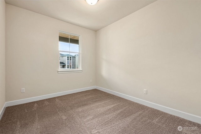 empty room with carpet flooring