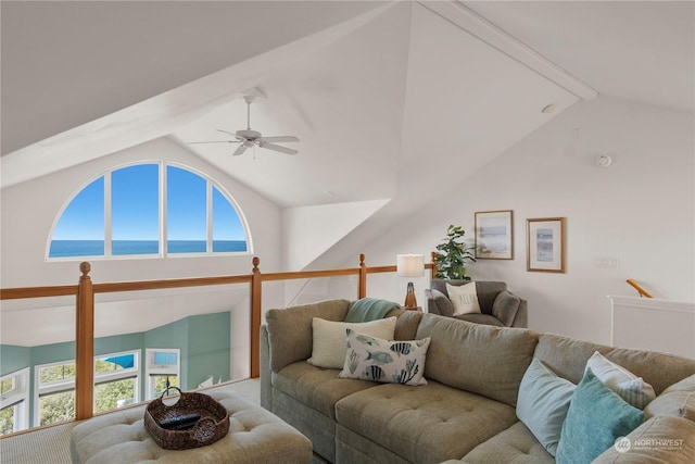 living room featuring vaulted ceiling, a water view, and plenty of natural light