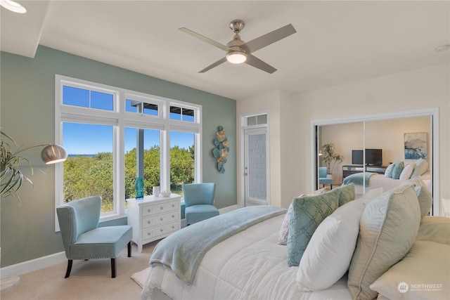 carpeted bedroom featuring ceiling fan