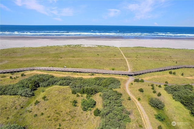 aerial view featuring a water view and a beach view