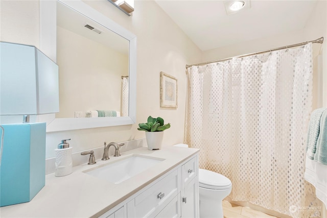 bathroom with tile patterned floors, vanity, toilet, and a shower with shower curtain