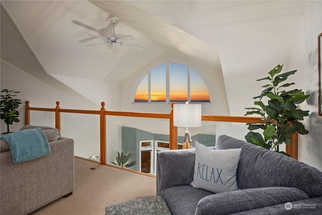 living area with lofted ceiling, carpet floors, and ceiling fan