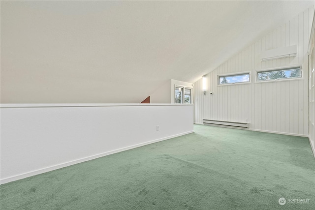 additional living space featuring lofted ceiling, a baseboard radiator, baseboards, and carpet flooring