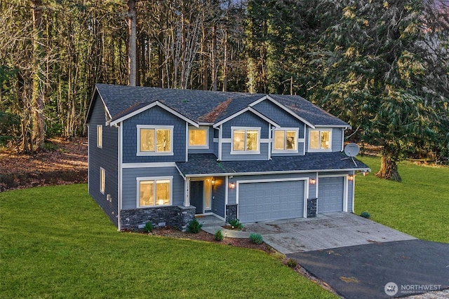 view of front facade with a garage and a front lawn