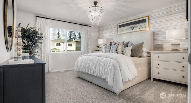 bedroom featuring light colored carpet and an inviting chandelier