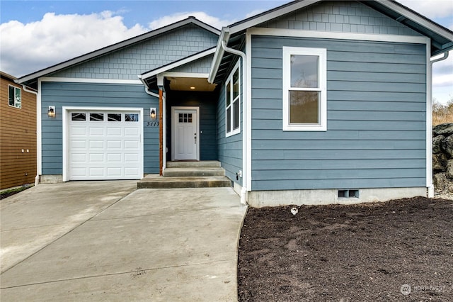 view of front facade with driveway and an attached garage