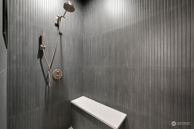 bathroom with a tile shower